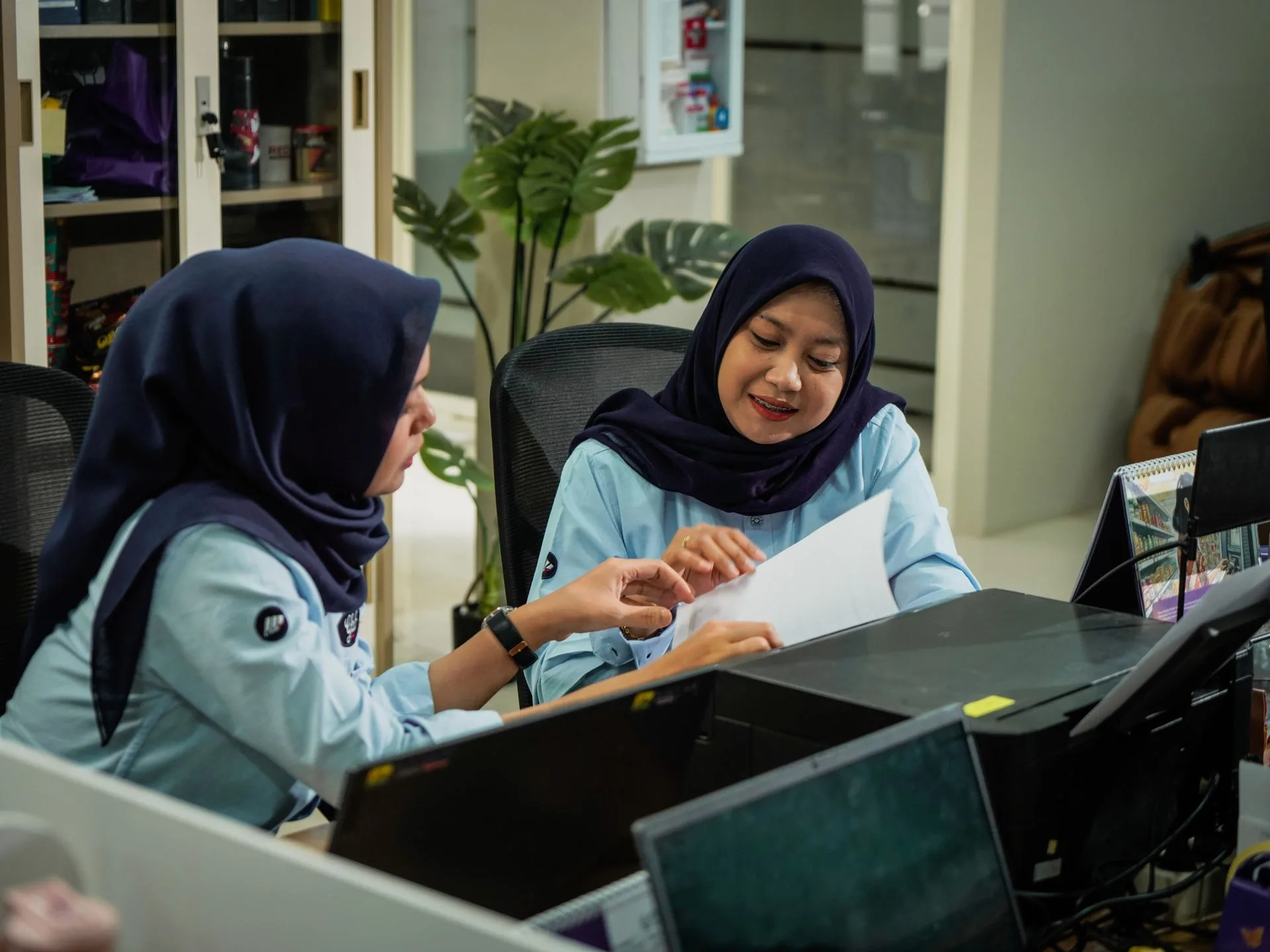 Colleagues collaborating at the office