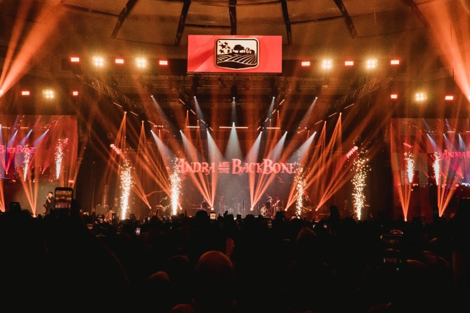 Arena concert with pyrotechnics and crowd