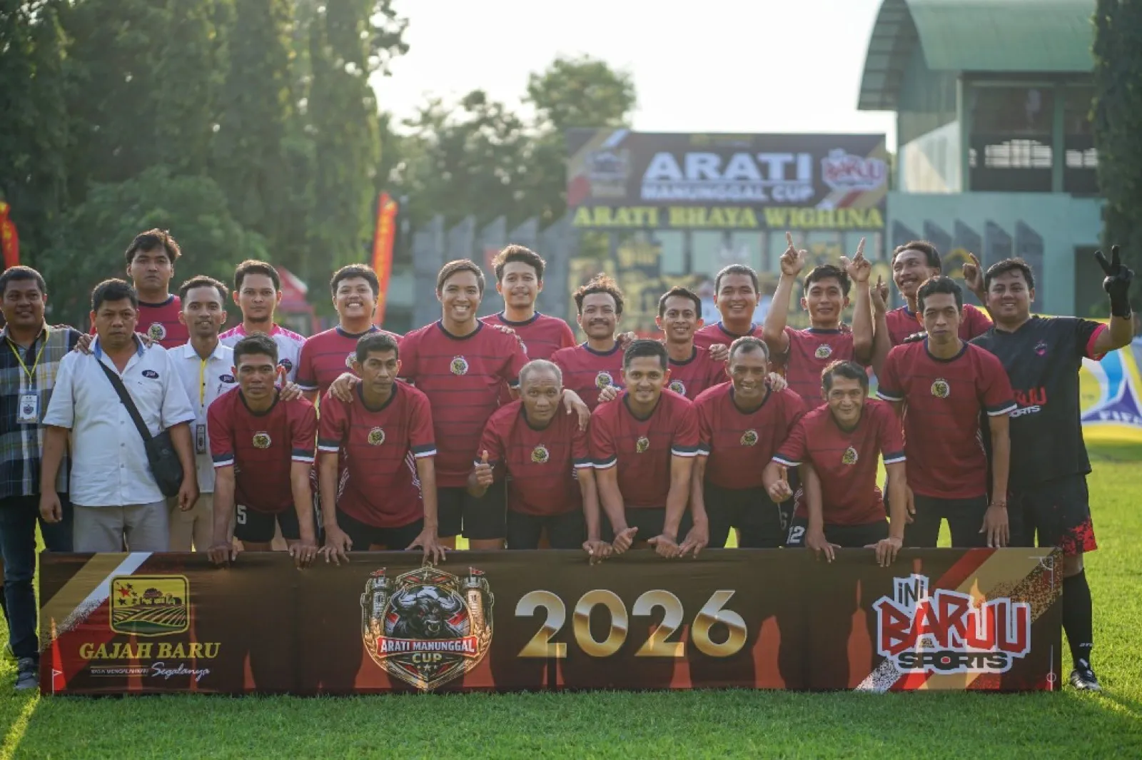 Football team photo with Arati Manunggal Cup banner