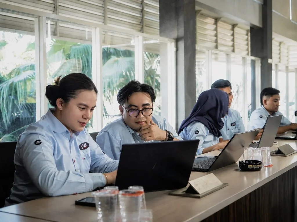 Team members reviewing work together